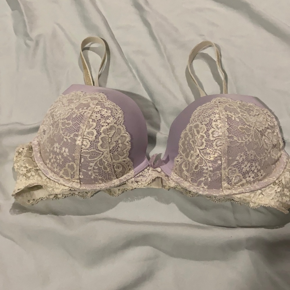 Pink Victoria Secret shimmering white lace bra.